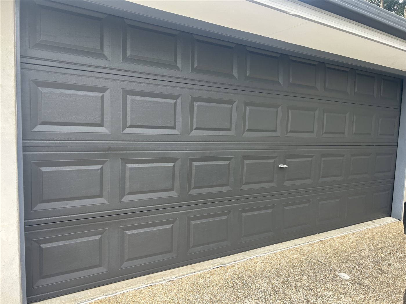 Garage door repainted in modern charcoal