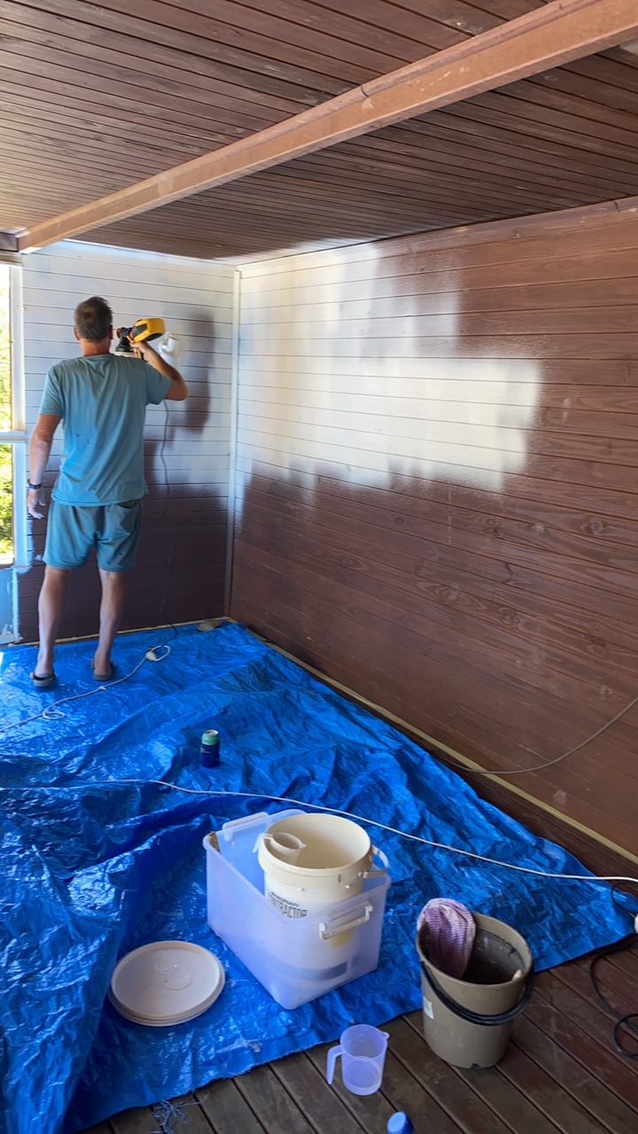 Dark timber pergola during repainting