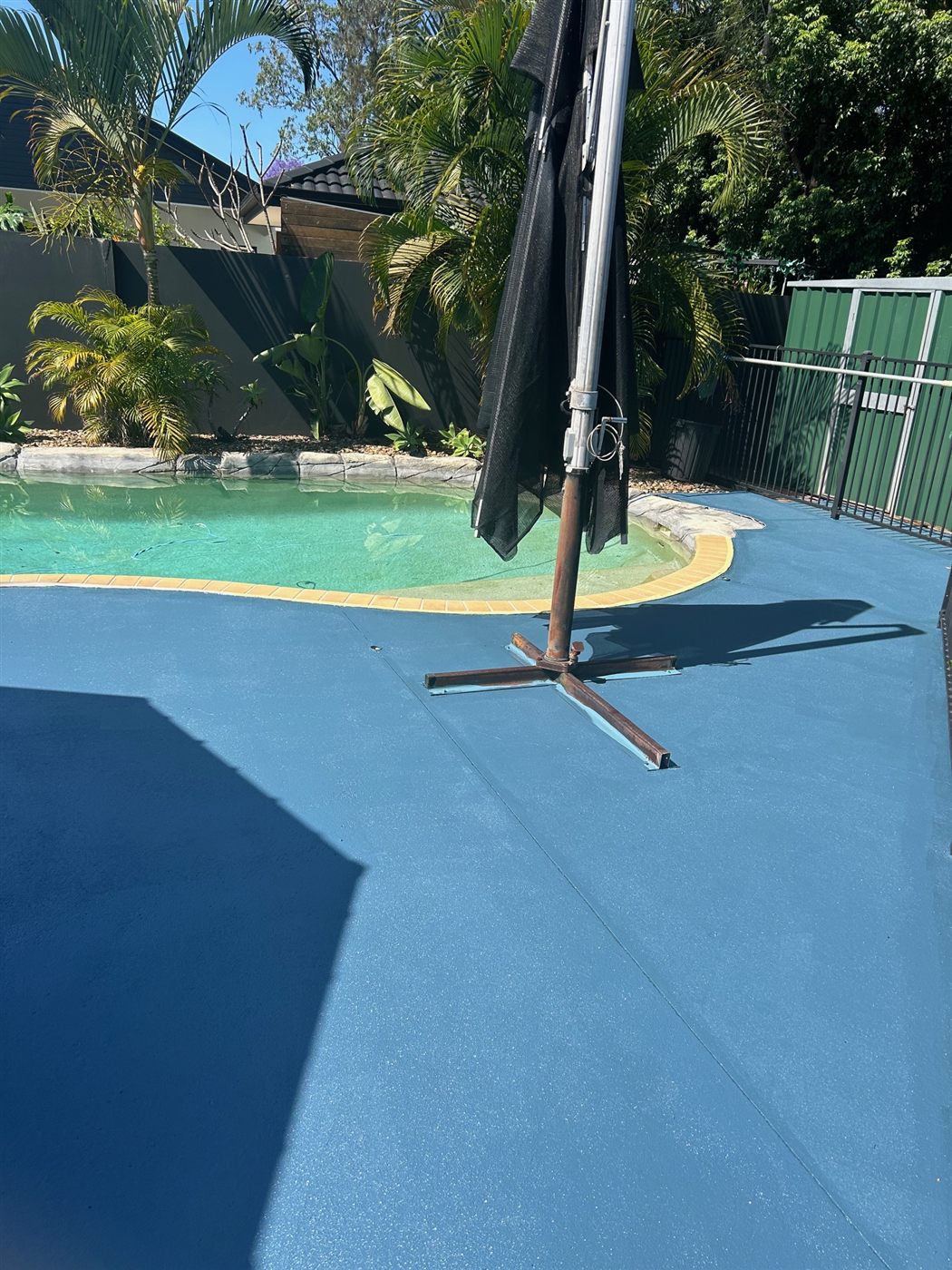 Pool surround repainted in fresh cool blue